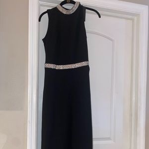 Beautiful black with rhinestone detail. Long slits on each side very sexy dress
